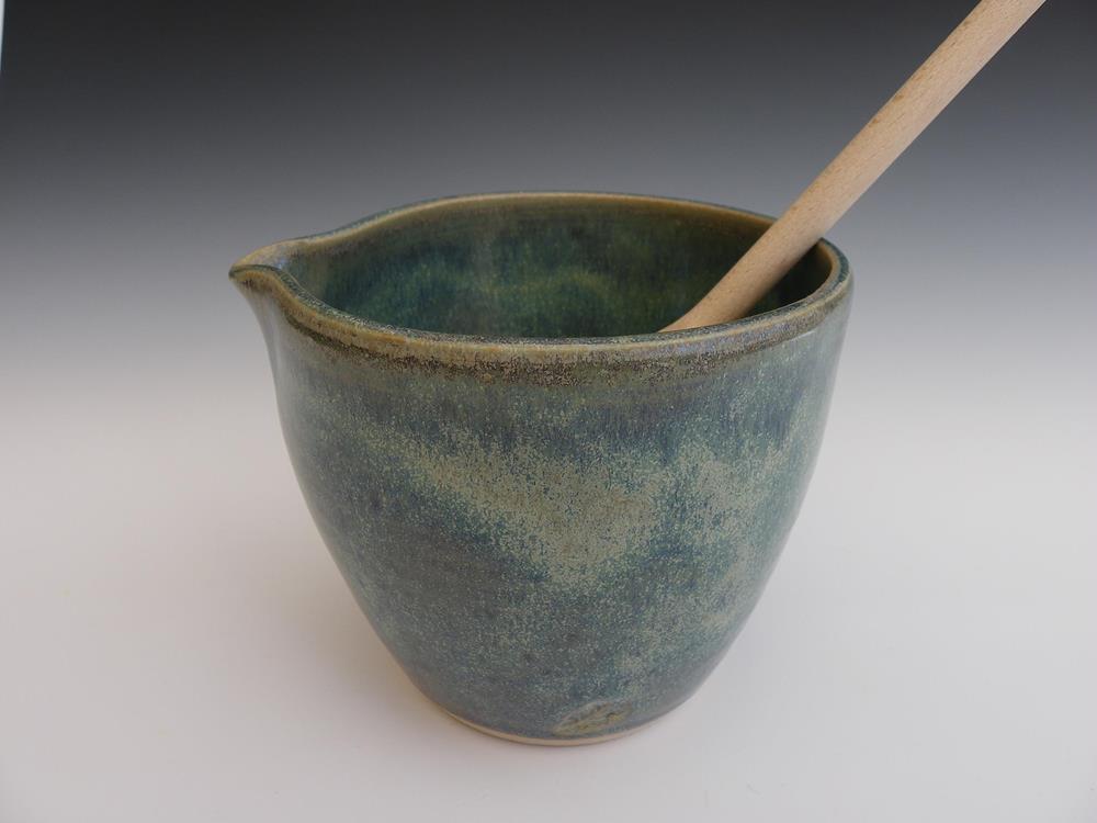 Small mixing bowl.
On Etsy for sale
Wooden spoon provided.
