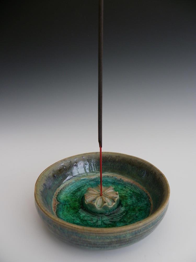 Incense stick holder.
Inspired by poppy seed head.
